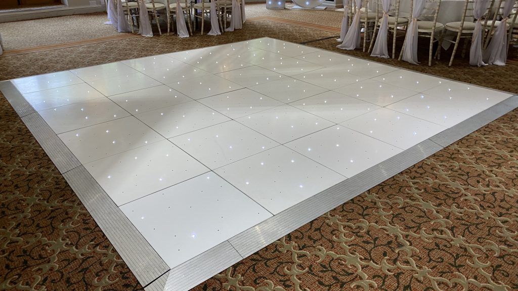 A white led starlit dance floor with silver trim