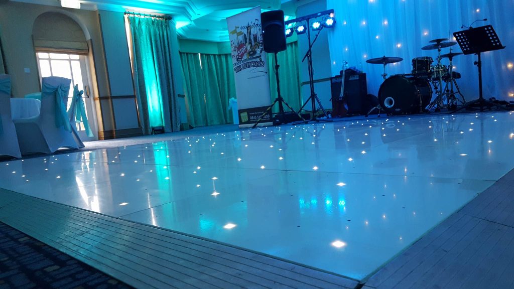 LED White starlit dance floor with blue lighting around the room