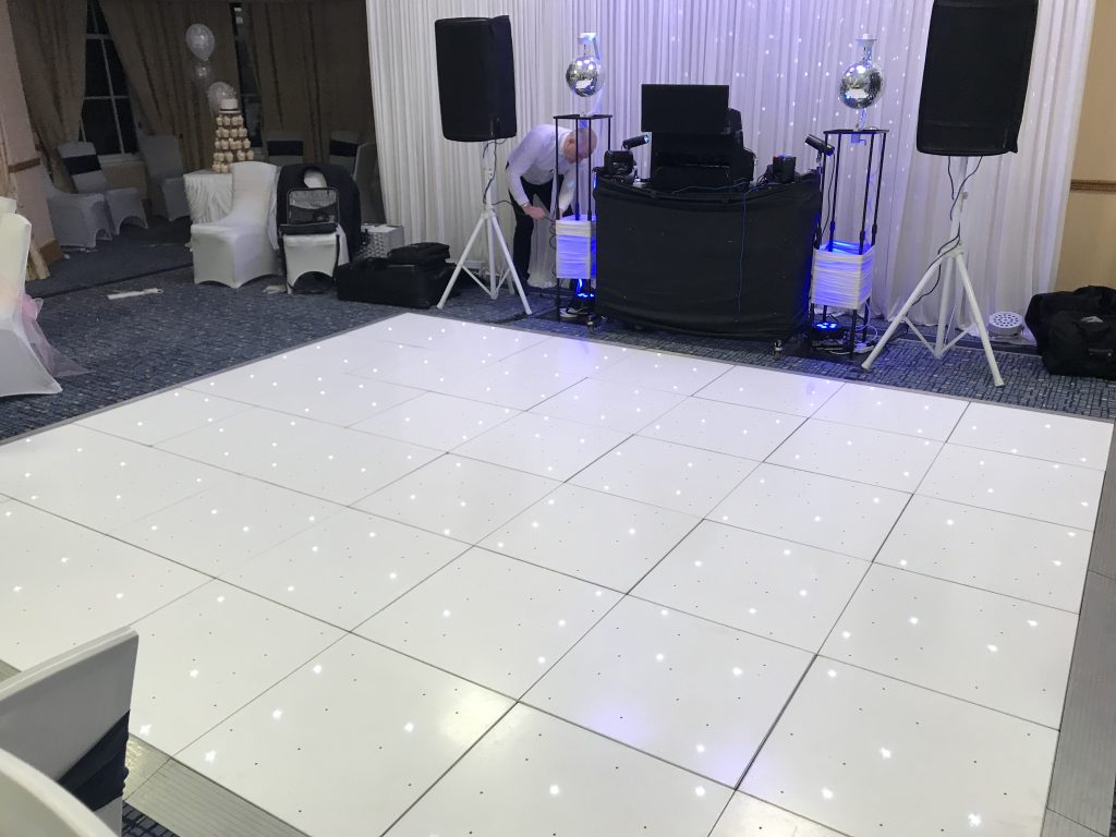LED starlit dance floor in front of a DJ booth