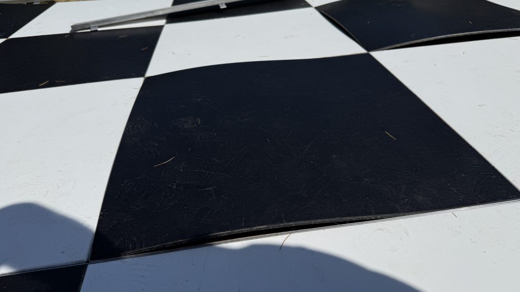 Damaged black and white dance floor
