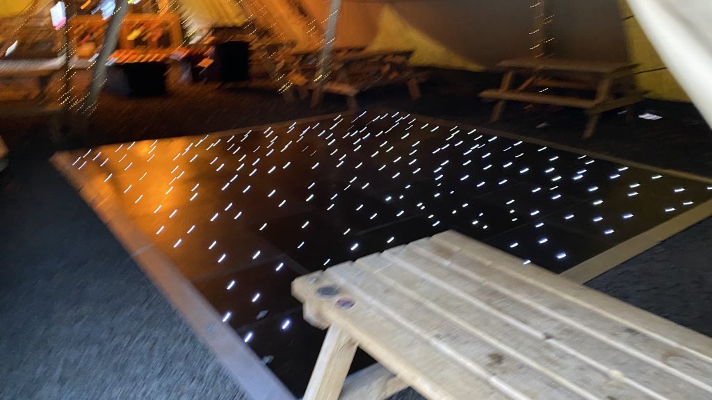 Black starlit dance floor with silver edge trim