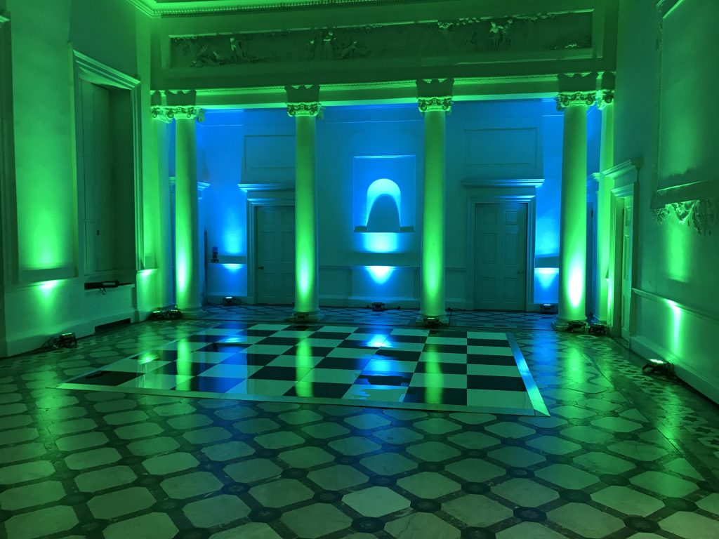 Black and white dance floor with green lighting