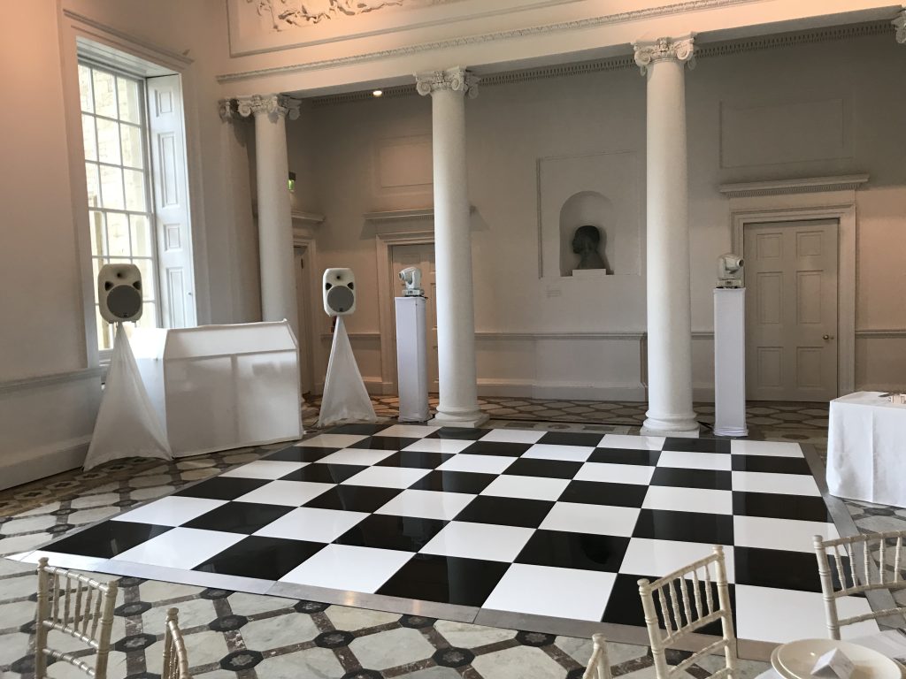 White disco with black and white chequered dance floor