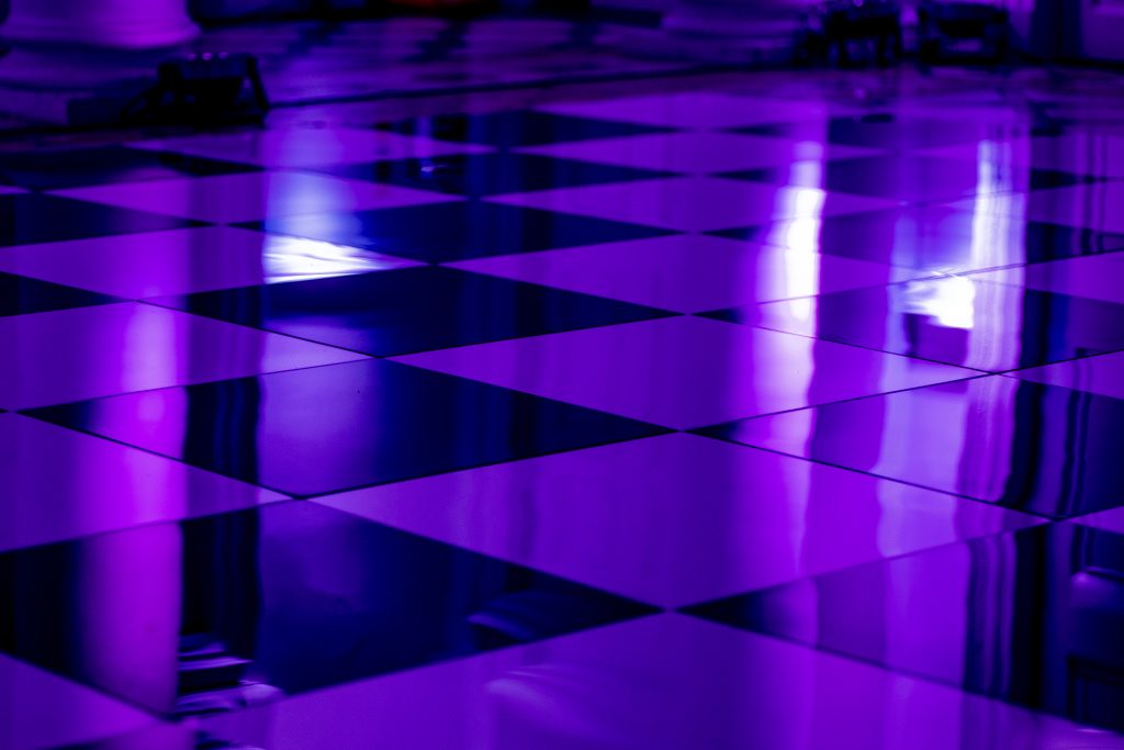 black and white dance floor with purple hue