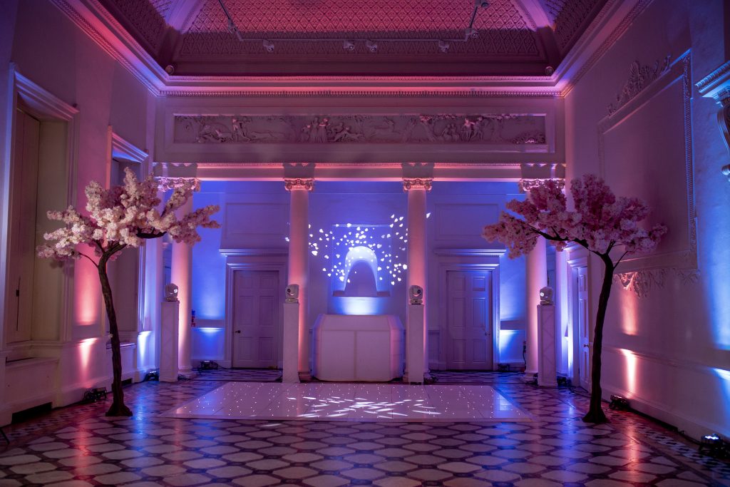 pink and blue lighting with white starlit dance floor