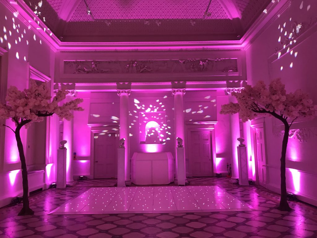 white starlit dance floor with bright pink lighting