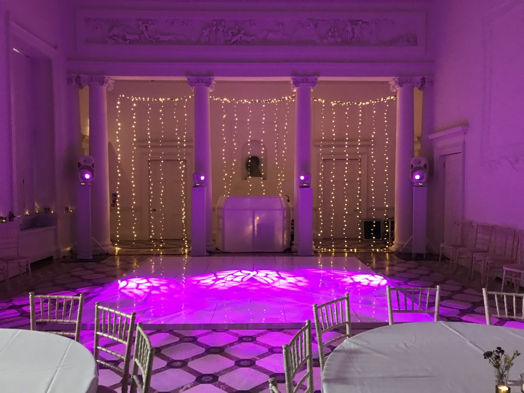 White starlit dance floor with fairy light backdrop