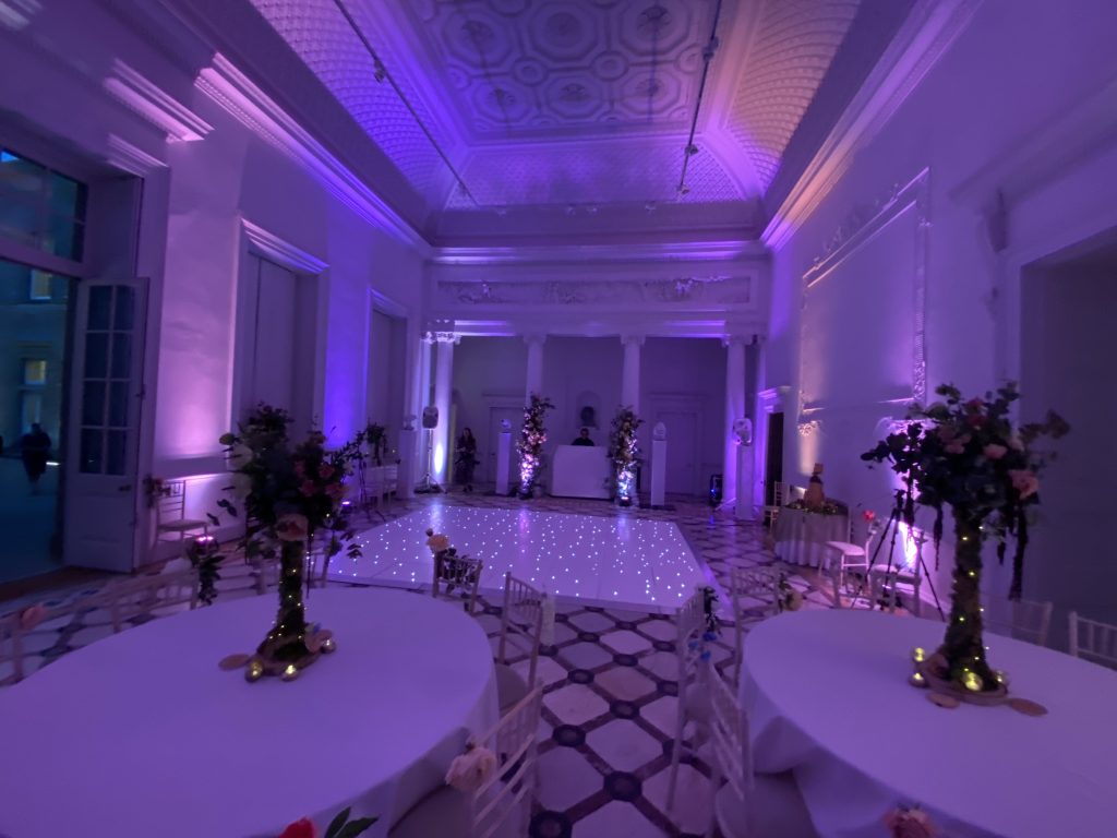 white starlit dance floor with light pink lighting