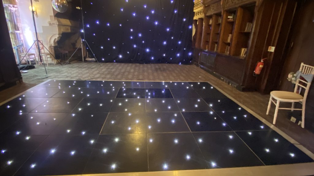 black starlit dance floor in the long gallery at ettington park