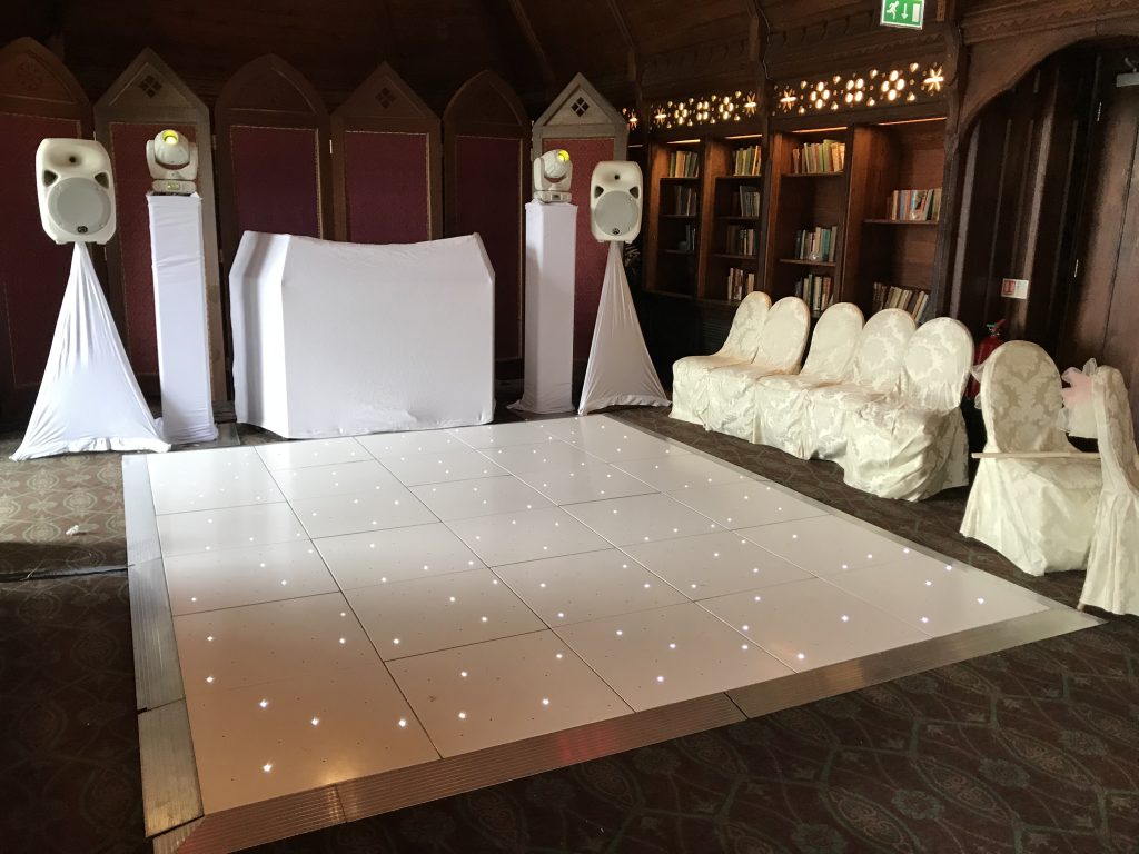 White starlit dance floor in the long gallery at ettington park