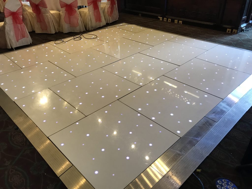 White starlit dance floor at Ettington Park in the long gallery