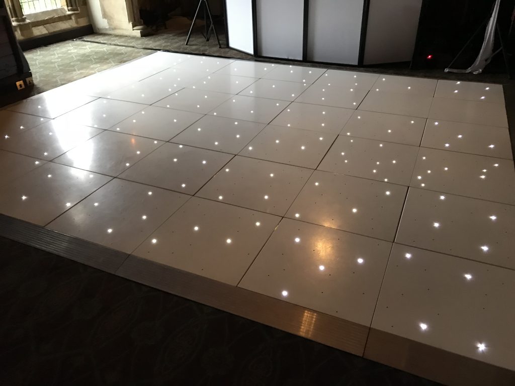 White starlit dance floor in the long gallery at Ettington Park