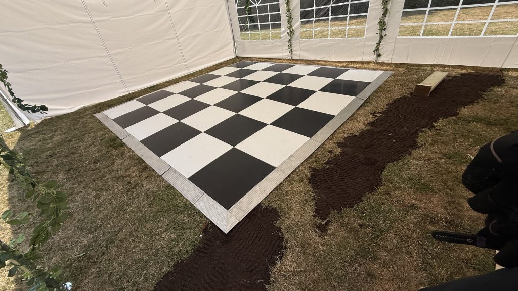 Black and white dance floor in a party tent