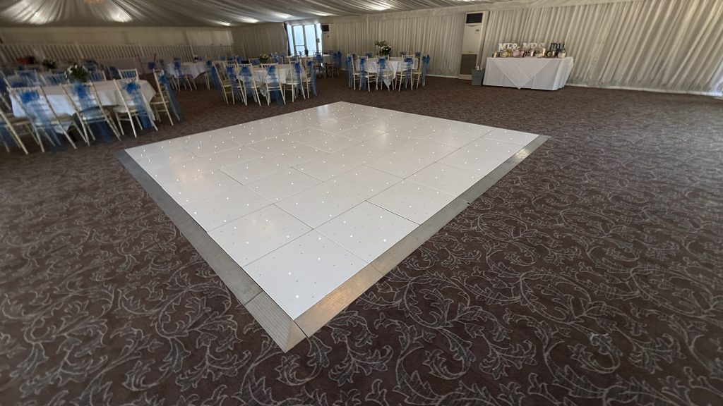 14'. 14' white starlit dance floor with silver trim in the marquee at stanbrook abbey
