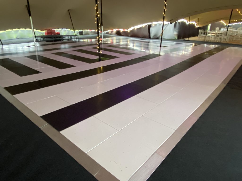 Geometric black and white dance floor pattern created for a last-minute event at Cirencester Polo
