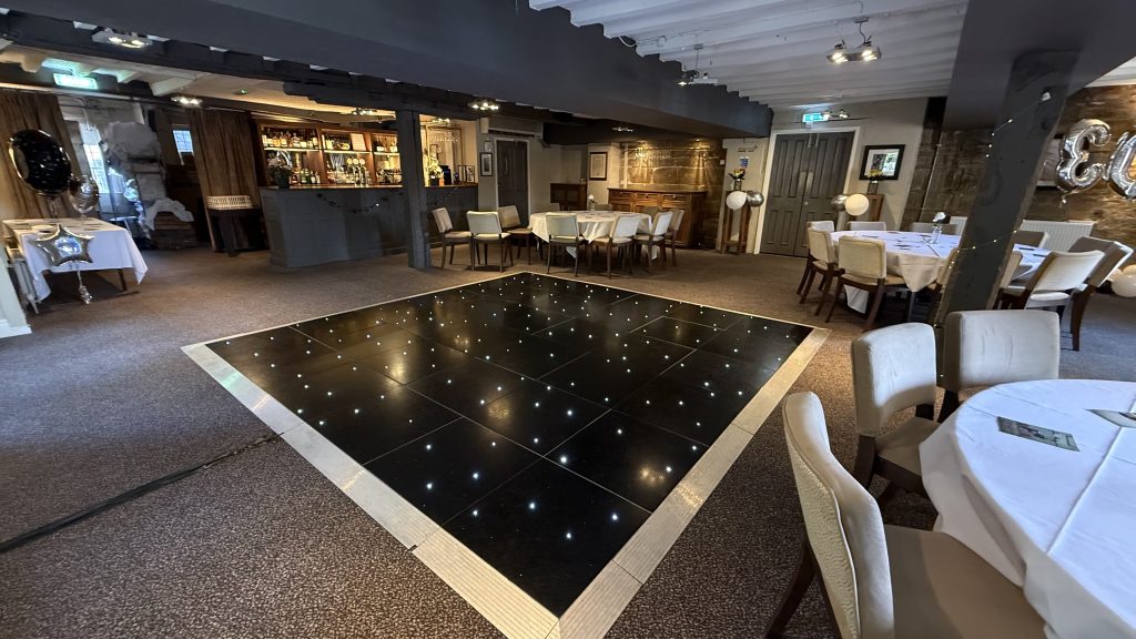 Small black starlit dance floor in the saxon mill in warwickshire