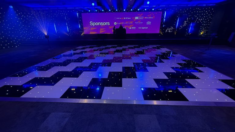30ft × 30ft black and white starlit dance floor facing the stage at The Vox